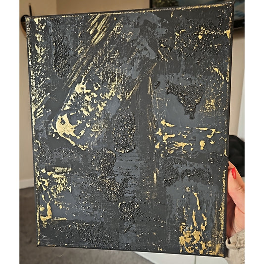 Black and gold textured art on canvas